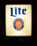 1985 Miller Lite Illuminated Wall Display With Clock. 18" X 12" 2.75" Made. Fixed Price $355.40.