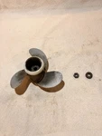 1975 Johnson 9.9 Hp Propeller, Grommet, And Nut 0386669. Fixed Price $20.00.